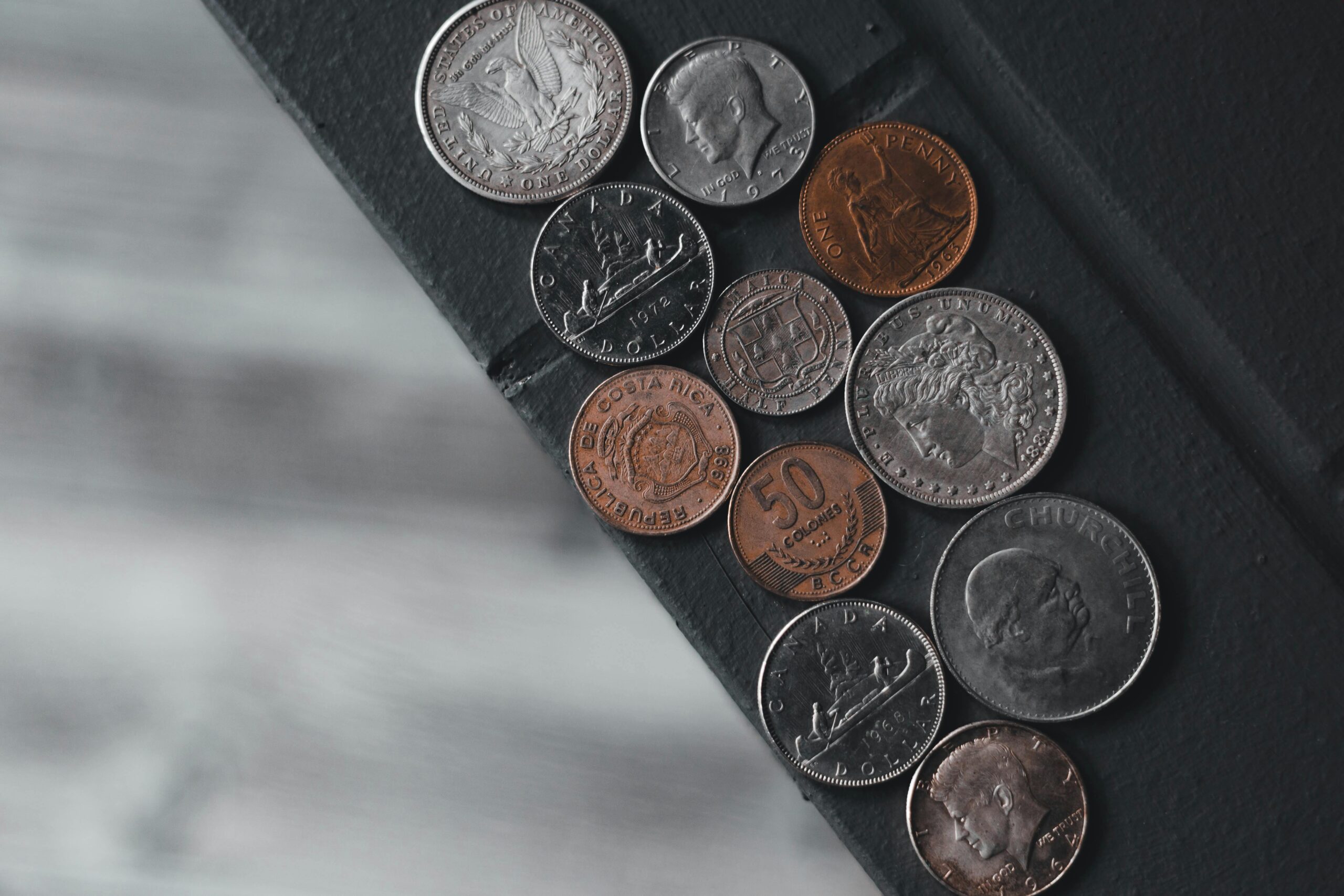rare coins displayed on a dark background