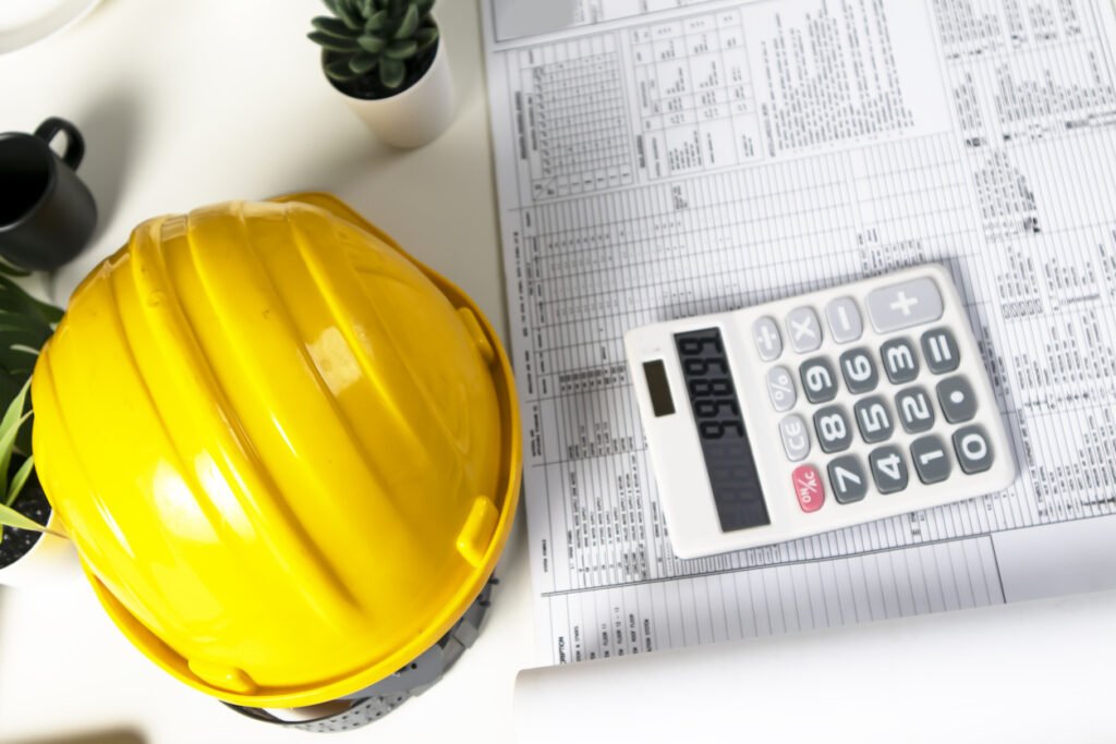 a calculator sits on a spreadsheet